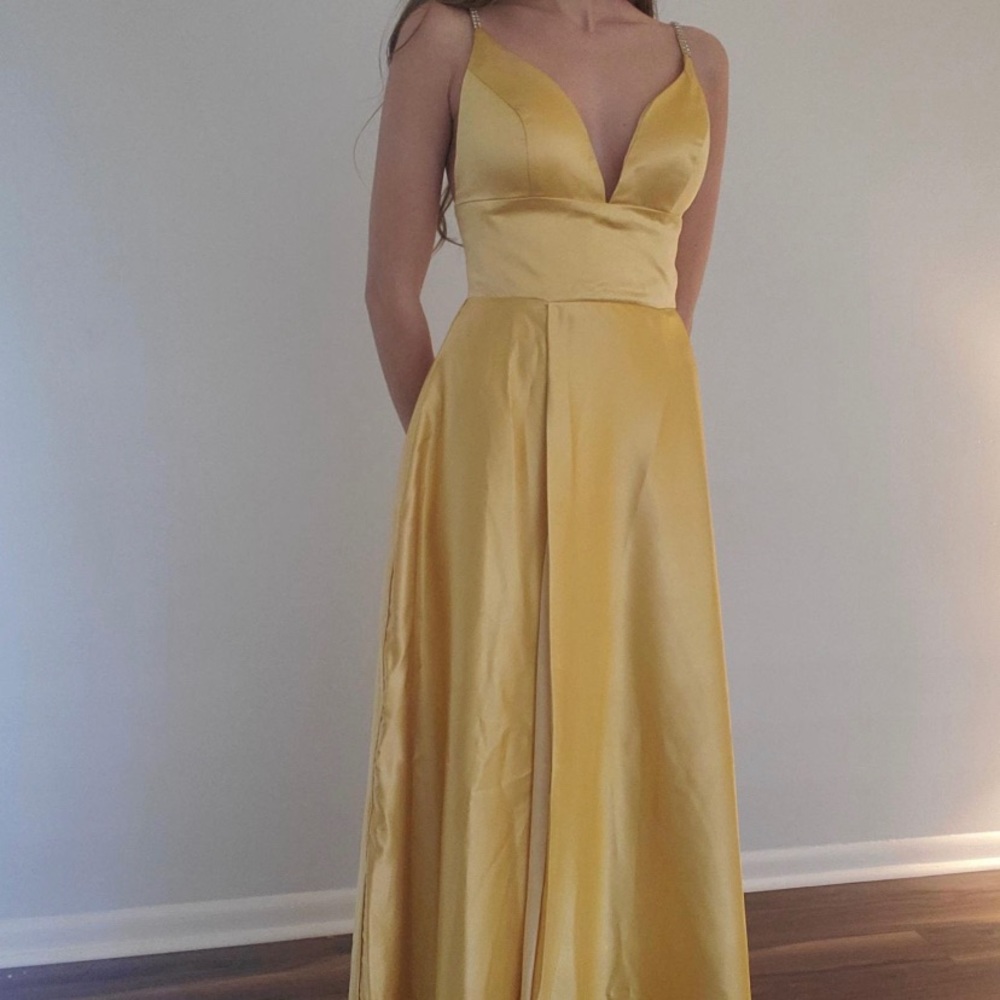 Beautiful dress purchased for a wedding.  Didn’t match bridesmaids. Never worn